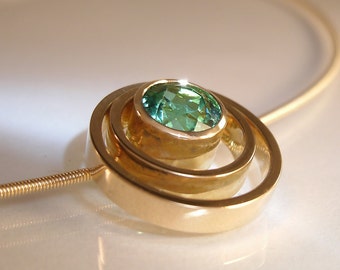 Gold pendant with tourmaline