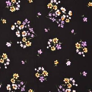 May include: Black fabric with a small floral pattern in shades of purple, yellow, and white.