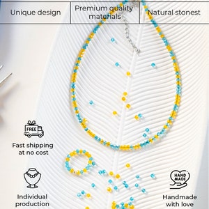 May include: A necklace and a bracelet made of blue and yellow beads. The necklace and bracelet are on a white surface with a leaf pattern. The text 'FREE', 'Fast shipping at no cost', 'Individual production', 'HAND MADE', and 'Handmade with love' are visible on the image.
