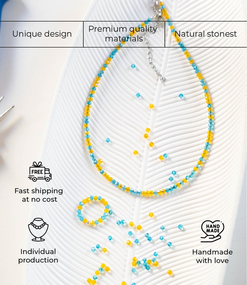 May include: A necklace and a bracelet made of blue and yellow beads. The necklace and bracelet are on a white surface with a leaf pattern. The text 'FREE', 'Fast shipping at no cost', 'Individual production', 'HAND MADE', and 'Handmade with love' are visible on the image.