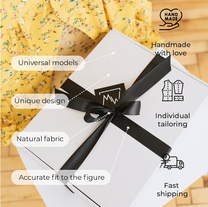 K&ouml;nnte beinhalten: Eine wei&szlig;e Geschenkbox mit schwarzem Band. Auf der Box stehen die Texte "Universelle Modelle", "Einzigartiges Design", "Naturstoff" und "Passgenauigkeit". Sie zeigt auch "Handgemacht mit Liebe", "Individuelle Ma&szlig;anfertigung" und "Schneller Versand".