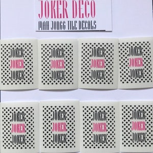May include: Eight white square tiles with black polka dots and the word "JOKER" repeated in pink letters. The tiles are arranged in two rows of four. The text "JOKER DECO MAH JONGG TILE DECALS" is visible at the top of the image.