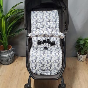 Forro de assento para carrinho de bebê - Dinossauros felizes - Fabricado na Austrália