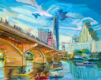 May include: A colorful painting of a cityscape with a bridge over a river. The bridge has multiple arches and is painted in shades of yellow, orange, and brown. The cityscape is painted in shades of blue, green, and pink. There are people in kayaks on the river.