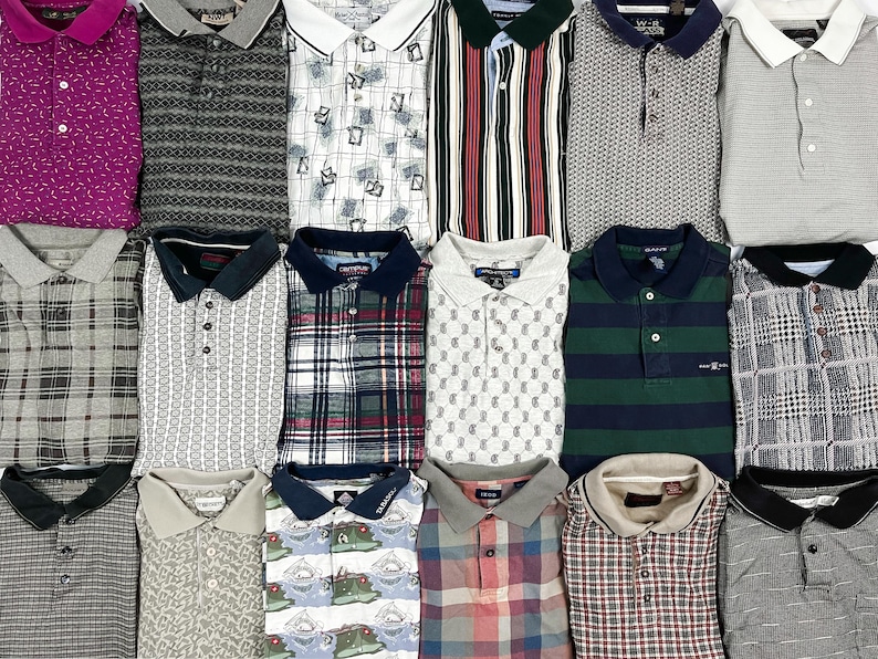 May include: A collection of eighteen short-sleeved polo shirts arranged in a grid, featuring various patterns including stripes, plaids, geometric prints, and solid colors with contrasting collars and button-down plackets in diverse fabric textures.