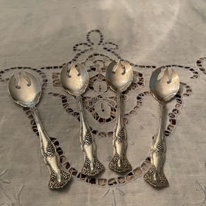 May include: A set of three ceramic mugs with a speckled, matte finish. The mugs are in shades of cream, light gray, and dark gray. Each mug has a simple, minimalist design, perfect for coffee or tea.