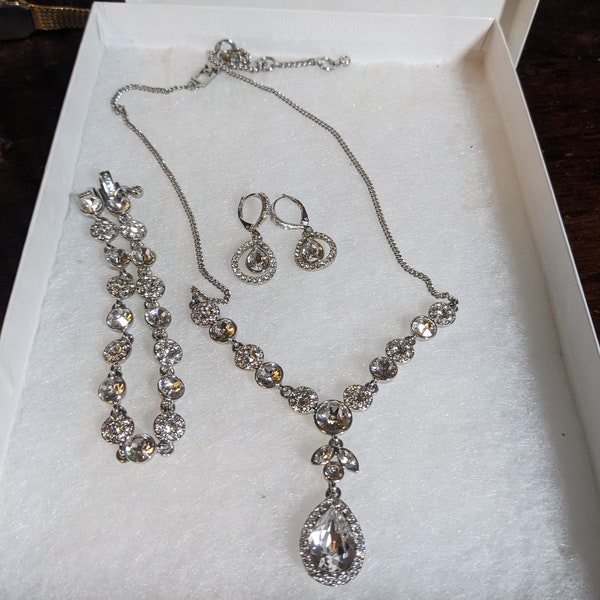 FREE SHIPPING- Vintage Gently worn, Signed Givenchy 3 piece Silver tone jewelry set with teardrop shaped clear rhinestones. See below