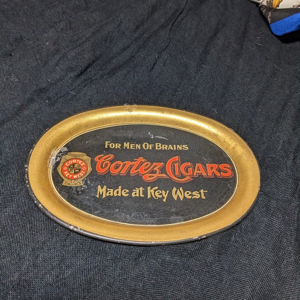 FREE SHIPPING- in Lithograph Printed Oval Tip Tray with Cortez Cigars- Men of Brains Key West Logo. See below for info re: damage on graphic