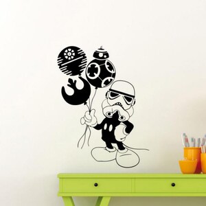 May include: A black and white illustration of a Stormtrooper holding three balloons. The balloons are shaped like the Death Star, the Millennium Falcon, and a character from Star Wars.
