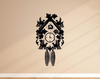 May include: Black and white silhouette of a cuckoo clock with a detailed design. The clock face has Roman numerals and a black hand.