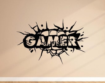 May include: Black and white wall decal with the word "GAMER" in a cracked wall design.