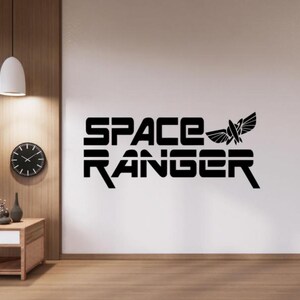May include: Black and white wall decal with the text "SPACE RANGER" and a stylized rocket ship.