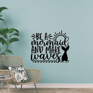 May include: Black and white wall decal with the text "Be a mermaid and make waves" with a sun and a mermaid tail.