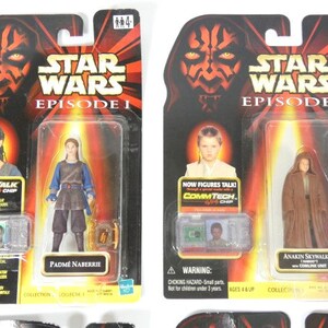 May include: Two Star Wars Episode I action figures in their original packaging. The figures are Padm&eacute; Amidala and Anakin Skywalker. The packaging features a red and black Darth Maul design with the Star Wars logo and episode title.