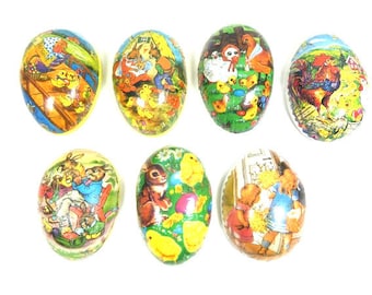 May include: Eight colorful Easter egg-shaped boxes with various images of animals and children. The boxes are decorated with bright colors and whimsical designs.