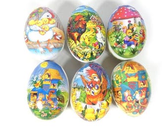 May include: Six colorful Easter eggs with different designs. The eggs feature images of chicks, roosters, bunnies, and other Easter-themed imagery.
