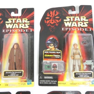 May include: Two Star Wars Episode I action figure packs. The figures are Anakin Skywalker and a Jedi Knight. The packaging features the Star Wars logo and the words "Now figures talk! CommTech Chip".