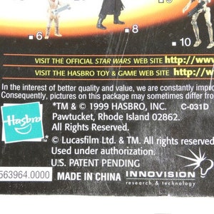 May include: A black and white action figure packaging featuring a Star Wars character on the front. The packaging includes the Hasbro logo and the text "*TM & &copy; 1999 HASBRO, INC. C-031D Pawtucket, Rhode Island 02862. All Rights Reserved."  The packaging also includes the text "Lucasfilm Ltd. & TM. All rights reserved. Used under authorization. U.S. PATENT PENDING 563964.0000 MADE IN CHINA INNOVISION research & technology".