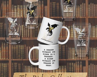 May include: A collection of drinkware including two white ceramic mugs and three clear glass tumblers. Each item features a black and yellow dragon graphic above an open book and the text: A DRAGON WITHOUT ITS RIDER IS A TRAGEDY. A RIDER WITHOUT ITS DRAGON IS DEAD.