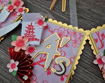 Banner personalizado con temática de sushi hibachi: guirnalda de fiesta con temática de flor de cerezo y comida asiática.