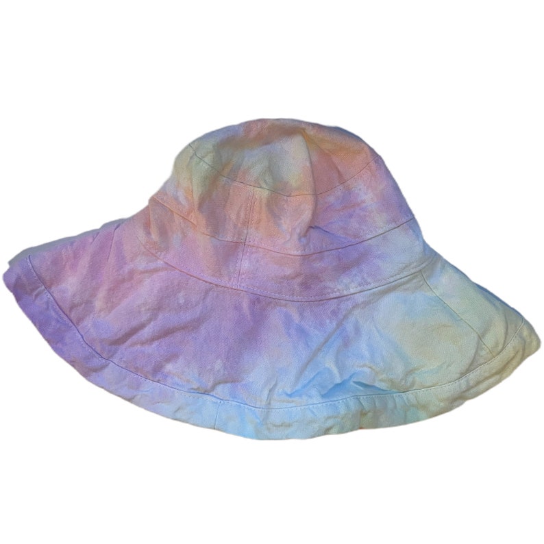 May include: A wide-brimmed sun hat with a tie-dye pattern in shades of pink, blue, and yellow.