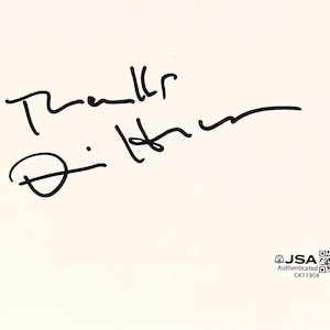 May include: A cream-colored card with a handwritten signature in black ink. The signature includes the words "Thanks" and "D. Hilton". A JSA authentication sticker is in the lower right corner.