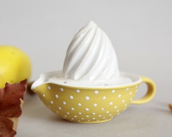 Yellow lemon squeezer with white dots