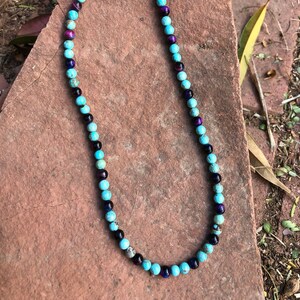 Handcrafted genuine turquoise and purple tiger eye necklace with sterling silver clasp.  19” long.  Made in Tucson, AZ USA