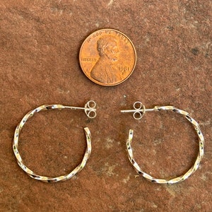 Beautiful twisted sterling silver wire hoop earrings.  PS9