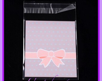 20 bolsas, bolsas de plástico con tira adhesiva - dimensión 12.5 x 8 cm, rosa y blanco