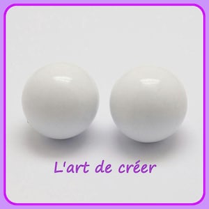May include: Two white round balls, smooth and glossy, with a slight sheen. The balls are arranged side by side on a white background.