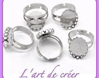 May include: Five silver adjustable rings with a scalloped edge bezel setting. The rings are designed to hold a 12mm round cabochon.