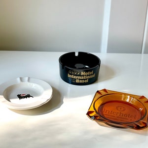 Set of 2 vintage hotel advertising ashtrays