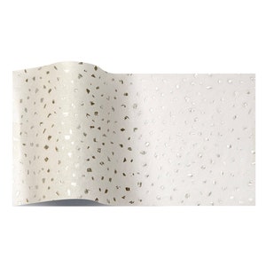 May include: White tissue paper with a silver confetti pattern.