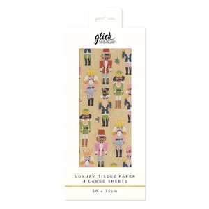 Puede incluir: Un paquete de papel de seda de lujo con un patrón repetido de figuras de cascanueces de colores sobre un fondo beige. La marca "glick" está en la parte superior. El papel de seda mide 50 x 75 cm.