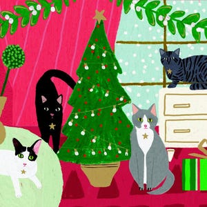 May include: A Christmas scene featuring a decorated green Christmas tree, a white chest of drawers with a wrapped green and gold gift, and four cats. Two of the cats are black and white, one is grey and white, and one is grey and black. The cats are all sitting or standing in various positions around the room.
