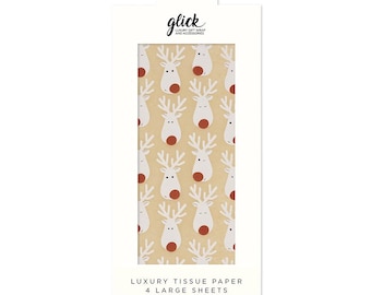 May include: Tan tissue paper with a repeating pattern of white reindeer with red noses and antlers. The packaging reads "glick LUXURY GIFT WRAP AND ACCESSORIES" and "LUXURY TISSUE PAPER 4 LARGE SHEETS" with dimensions of 50 x 75cm.