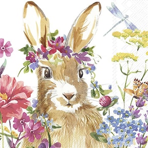 May include: A watercolour illustration of a brown rabbit wearing a flower crown. The rabbit is surrounded by colourful flowers, including pink, purple, blue, and yellow. There is a dragonfly in the background.