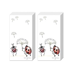 May include: Two packs of white paper napkins with a ladybug design. Each napkin features two ladybugs holding a dandelion with a white fluffy seed head. The text "buti-jemma" is printed on each napkin.