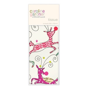 May include: A pack of Caroline Gardner Christmas tissue paper featuring a white background with two pink reindeer with red noses. The reindeer are outlined in black and have a pink and white polka dot pattern. The text "Caroline Gardner Christmas tissue" is printed on the front of the pack. The pack contains 4 sheets of tissue paper, each measuring 500 x 700 mm.