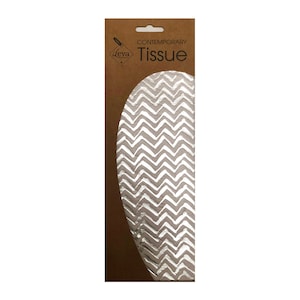 May include: A pack of white tissue paper with a zig-zag pattern. The pack is brown and has the text "CONTEMPORARY Tissue" on it.