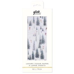 May include: Tissue paper with a winter landscape design, showing skiers and fir trees. The packaging includes the text "glick LUXURY GIFT WRAP AND ACCESSORIES" and "LUXURY TISSUE PAPER 4 LARGE SHEETS", with dimensions of 50 x 75 cm.