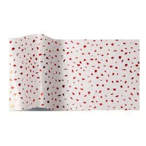 May include: White tissue paper with a red and gold confetti pattern.