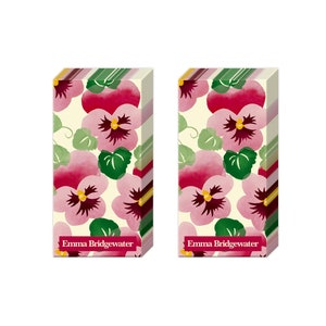 May include: Two packs of paper napkins with a floral design. The napkins feature a watercolour-style pattern of pink and purple pansies on a cream background. The text "Emma Bridgewater" is printed on the bottom of each pack.