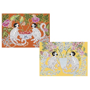 May include: Two sets of black and white spotted monkeys with red and green accents are depicted in a jungle setting. The monkeys are sitting on branches and eating fruit from a bowl. The background is a vibrant orange and yellow.