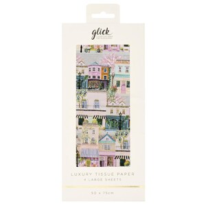 May include: A rectangular package of Glick luxury tissue paper containing 4 large sheets. The packaging features a colourful illustration of a European-style street scene with multi-story buildings, storefronts, and trees. The text reads 50 x 75cm.