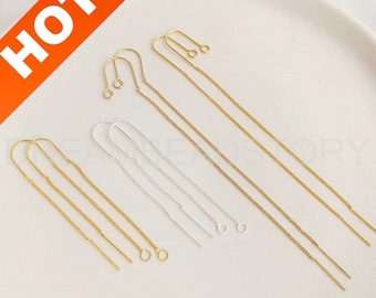 May include: A set of six gold and silver earring chains with different end pieces. The chains are about 2 inches long and have a delicate, chain-link design. The end pieces include a small loop, a straight wire, and a small circle.