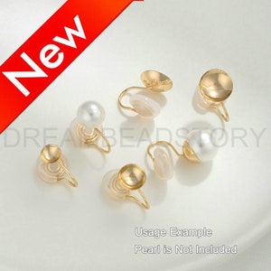 May include: Gold tone earring clips with a pearl. Usage Example: Pearl is Not Included.