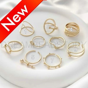 May include: Nine gold rings of different styles and designs. The rings are numbered 1 through 9.