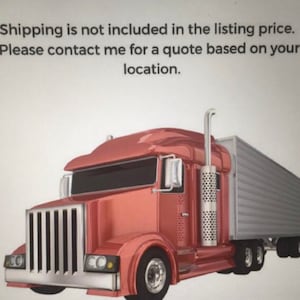 May include: A red semi-truck with a silver trailer. The truck has a large front grill, black windows, and a tall exhaust pipe. The image includes text about shipping costs.